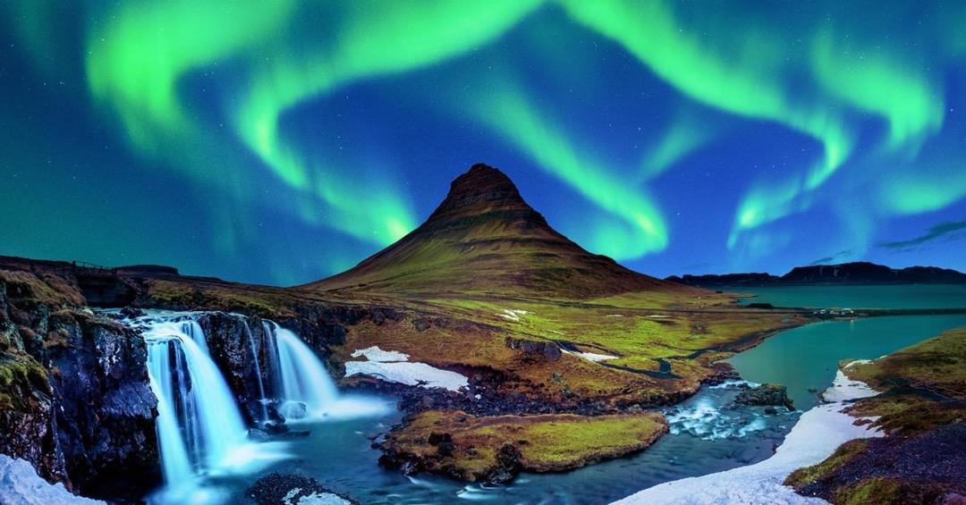 an image of Kirkjufell in Snaefellnes Iceland with northern lights - 2 Weeks in Iceland Itinerary